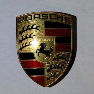 Porsche Crest Badge – Gold-Plated Base with Translucent Red and Black Lettering